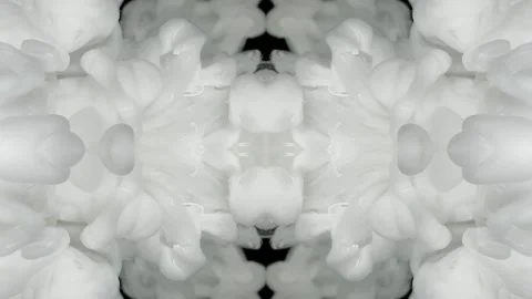 White ink drifts through dark water in a mirrored abstract formation Stock Footage 338109380