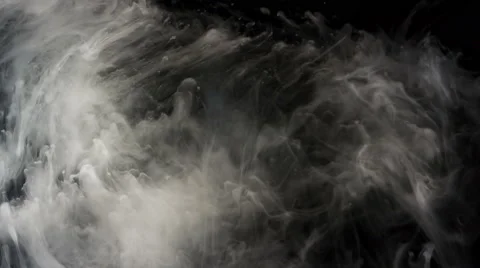 White ink moving slowly, slow motion, on black background, 4K Stock Footage