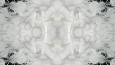 White ink spreading in close-up as mirrored plumes form Stock Footage 338271133