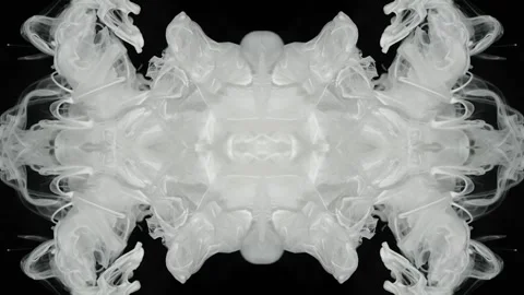 White ink stretches into a horizontal mirrored frieze on black Stock Footage 338109915