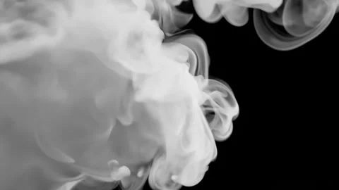 White ink swirling dynamically over dark background, creating fluid abstract Stock Footage 310439031