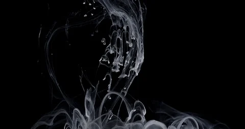 White ink threads and lumps moving and turning around in slow motion Video stock 99585551