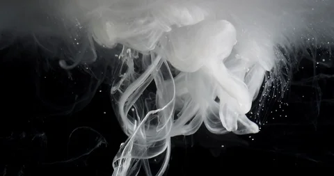 White ink threads ascending in slow motion and moving slowly above Stock Footage 99624339