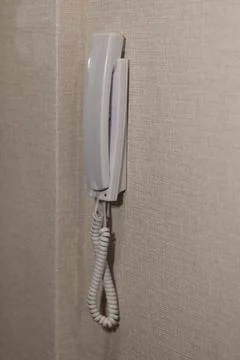 White intercom on the wall Stock Photos