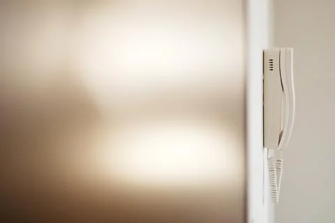 White intercom on the wall Stock Photos