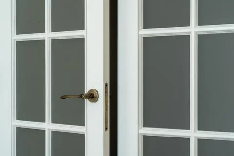 White interior double door with glass panels and vintage handle Stockfoto's