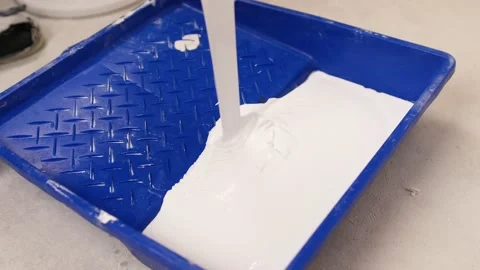 White interior paint is poured into the container. Home painting 스톡 동영상 164781815
