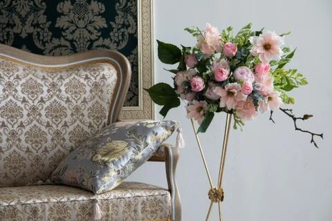White interior of studio with white and pink flowers. Stock Photos