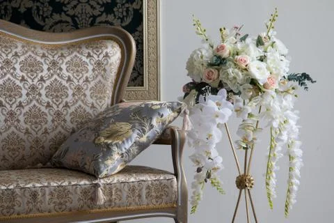 White interior of studio with white and pink flowers. Stock Photos