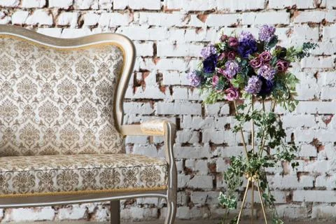 White interior of studio with white and pink flowers. Stock Photos