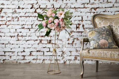White interior of studio with white and pink flowers. Stock Photos