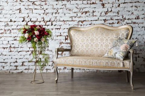 White interior of studio with white and pink flowers. Stock Photos