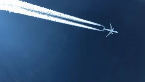 White inversion trace airplane on a clear blue sky. Stock Footage 100626634
