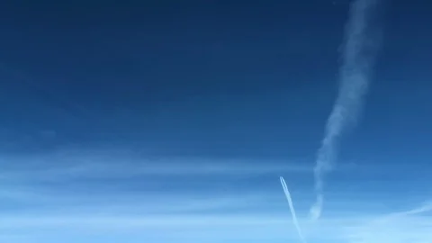 White inversion trace airplane on a clear blue sky. Stock Footage 100627346
