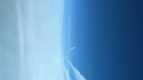 White inversion trace airplane on a clear blue sky. Stock Footage 100627787