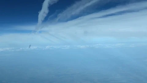 White inversion trace airplane on a clear blue sky. Stock Footage 100627913