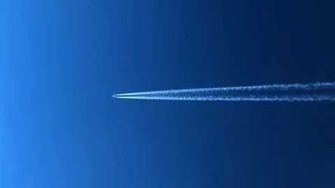 White inversion trace airplane on a clear blue sky. Stock Footage 100628176
