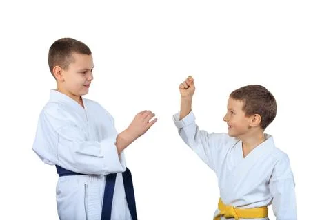 On a white isolated background two cheerful athletes Stock Photos