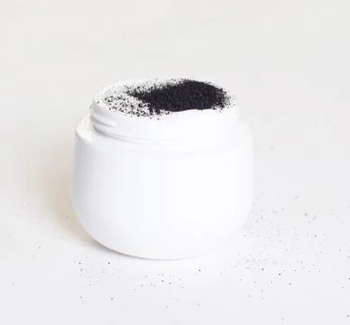 White jar with problem and dry skin care cream with activated charcoal, isolate Foto stock