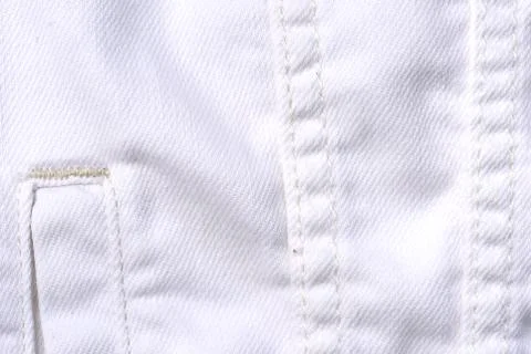 White jeans jacket texture close up. Denim background Stock Photos
