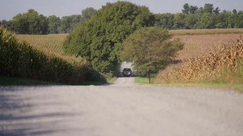 White Jeep Drone Shot driving through Countryside Farms Bridge River Video stock 246703839