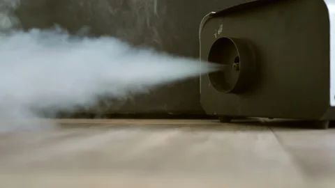 White jet of steam from a smoke generator on a dark background. Fog of dry smoke Stock Footage 201724248