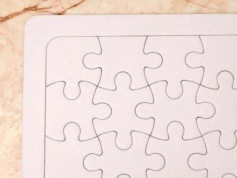 White jigsaw puzzle background for teamwork and problem solving Foto stock