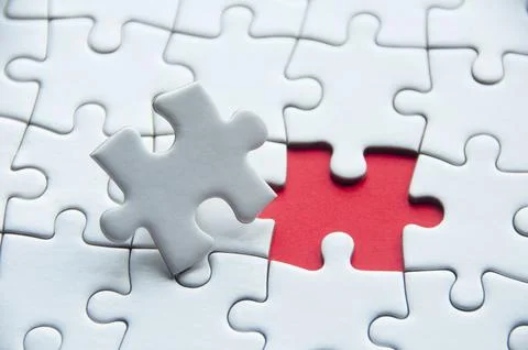 White jigsaw puzzle with customizable space for text or idea. Copy space. Stock Photos