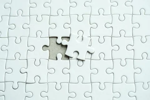 White jigsaw puzzle last missing Stock Photos
