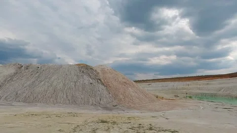 White kaolin clay slopes in an abandoned quarry Stock Footage 344812207