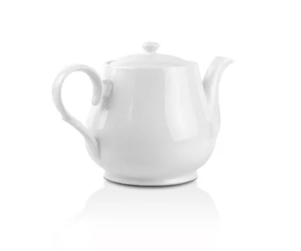 White kettle on white background. Side view of ceramic teapot . Stock Photos