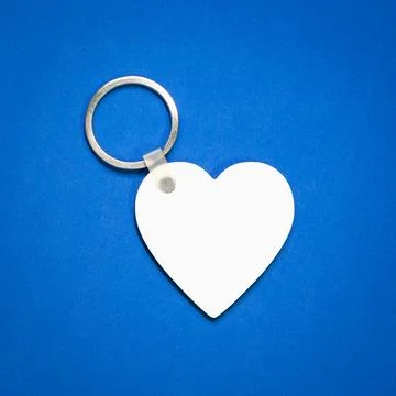 White key ring on blue background. Key chain for your design. Hanging acces.. Stock Photos