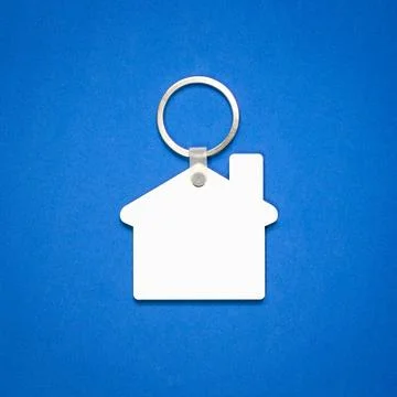 White key ring on blue background. Key chain for your design. Hanging acces.. Stock Photos