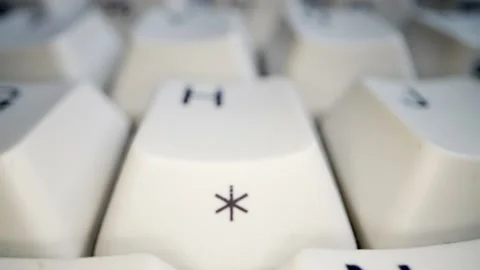 White keyboard asterisk key. Camera movement. Macro photography. Stock Footage 146107104