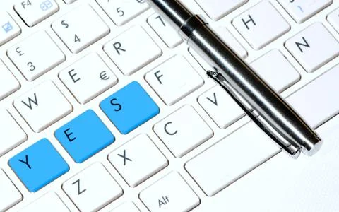 White keyboard as decision making concept and pen. Stock Photos