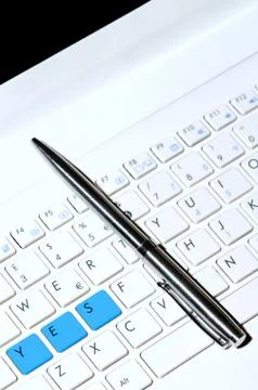 White keyboard as desicion making concept and pen. Stock Photos