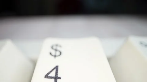 White keyboard dollar sign. Camera movement from left to right. Macro footage. Stock Footage 146106993