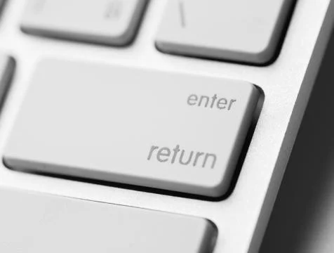 White keyboard enter key Stock Photos