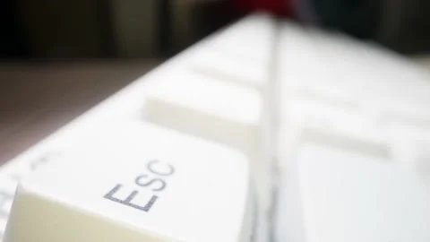 White keyboard ESC key. Camera movement from left to right. Macro photography. Stock Footage 146106920
