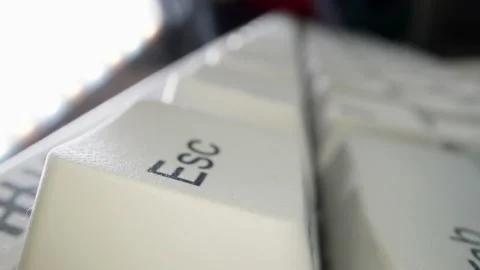 White keyboard ESC key. Camera movement from left to right. Macro photography. Stock Footage 146106970