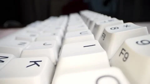 White keyboard keys. Camera movement from left to right. Macro photography. Stock Footage 146107312