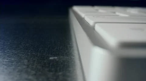 White keyboard on a silver table Stock Photos