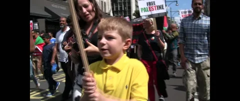 White kid in Huge Crowd Marching for Gaza on August 9 2014 London UK Stock Footage 144325611
