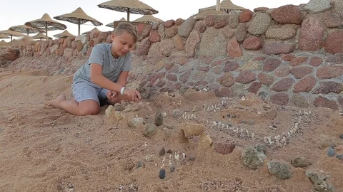 White kid making beautiful sand castle playing at seashore Video stock 113448873