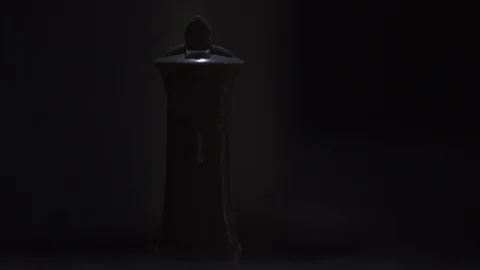 White king chess piece on dark staircase Stock Footage 91132536