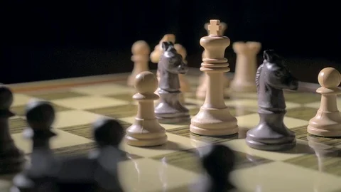 White king flanked by two black horses Stock Footage 73230894