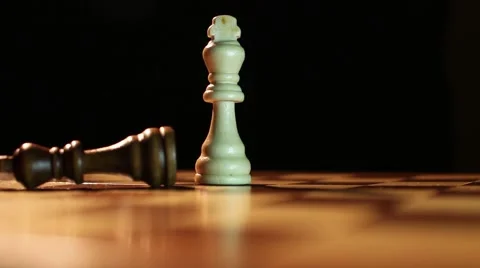 A white king overthrows the black king on a chess board 스톡 동영상 58415624
