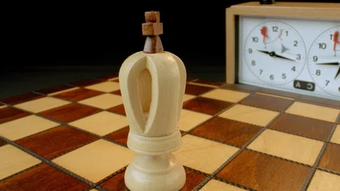 White king on rotating chess board, macro Stock-Footage 112049615