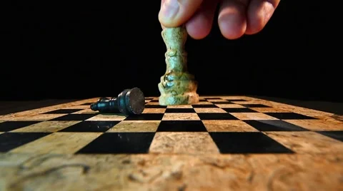 The white king throws down the black king on a chess board 스톡 동영상 58420999