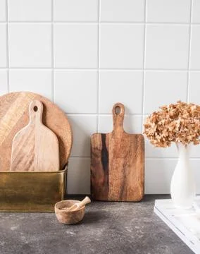 White kitchen background with brown kitchen utensils Stock Photos